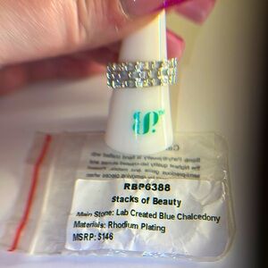 Lab created blue chalcedony a size 8 on rhodium plating MSRP:$146